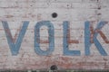 The German word `Volk` people written on a wall of concrete Royalty Free Stock Photo