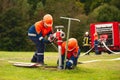 Germany, Baden Wurttemberg, Niederstetten. September 2019. Young firefighters in training, pumping water