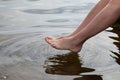 Germany, Baltic Sea, woman, feet in the water