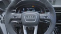 Germany, Berlin - April 2021: Audi car steering wheel. Action. Luxury and multifunctional interior of new car from Audi