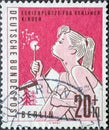 GERMANY, Berlin - CIRCA 1960: a postage stamp from Germany, Berlin has the motto: Vacation spots for children in Berlin Here: girl