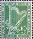 GERMANY, Berlin - CIRCA 1950: a postage stamp from Germany, Berlin showing a harp and the text: For the reconstruction of the Berl