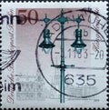 GERMANY, Berlin - CIRCA 1979: a postage stamp from Germany, Berlin showing 300 years of historical street lighting: gas hanging la