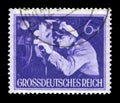 GERMANY - CIRCA 1944: German historical stamp: The commander of the submarine at the periscope. The Army Of The third Reich. Day o