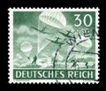 GERMANY - CIRCA 1943: German historical stamp: Paratroopers of the Wehrmacht  parachute in with transport aircraft Junkers Ju 52, Royalty Free Stock Photo