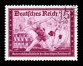 GERMANY - CIRCA 1939: German historical stamp: Young women employees of postal services take part in sports competitions. German p