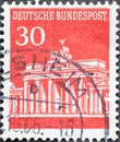 GERMANY - CIRCA 1966: a postage stamp from Germany, showing the Brandenburg Gate in Berlin red