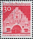 GERMANY - CIRCA 1966: a postage stamp from Germany, showing buildings in Germany. The north gate in Flensburg Schleswig