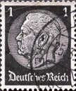 GERMANY - CIRCA 1933: a postage stamp from Germany, showing a portrait of the Reich President Paul von Hindenburg on a medallion