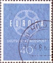 GERMANY - CIRCA 1959: a postage stamp printed in Germany showing a Chain symbol in white with the word Europe. The background is b