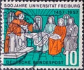 GERMANY - CIRCA 1957: a postage stamp printed in Germany showing an historical university lecture. Text: 500 years of the Universi