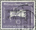 GERMANY - CIRCA 1956: This postage stamp in purple shows a spinet and musical notes and was brought out on the occasion of the 200