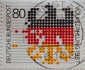 GERMANY - CIRCA 1987 : a postage stamp from Germany, showing the federal eagle in black, red and gold as a design of a calculatio