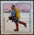 GERMANY - CIRCA 1994: a postage stamp from Germany, showing a historic postman with ice skates in Spreewald Germany around 1900. S