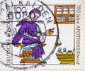 GERMANY - CIRCA 1991 : a postage stamp from Germany, showing a historical portrait of a pharmacist with scales and tools. Text: 75
