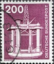 GERMANY - CIRCA 1975: a postage stamp from Germany, showing a motif from industry and technology. offshore oil rig