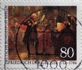 GERMANY - CIRCA 1986 : a postage stamp from Germany, showing a painting of the flute concert by King Frederick the Great of Pruss