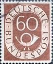 GERMANY - CIRCA 1951: a postage stamp from Germany, showing a sign Deutsche Bundespost with post horn  brown Royalty Free Stock Photo