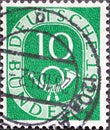 GERMANY - CIRCA 1951: a postage stamp from Germany, showing a sign Deutsche Bundespost with post horn green