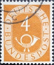 GERMANY - CIRCA 1951: a postage stamp from Germany, showing a sign Deutsche Bundespost with post horn   ocher Royalty Free Stock Photo