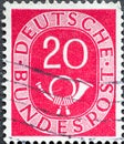 GERMANY - CIRCA 1951: a postage stamp from Germany, showing a sign Deutsche Bundespost with post horn red