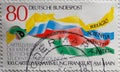 GERMANY - CIRCA 1986 : a postage stamp from Germany, showing some colorful ribbons with basic principles of the Cartell Associati