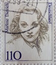 GERMANY - CIRCA 1997 : a postage stamp from Germany, showing a woman from German history the German-American actress and singer Ma Royalty Free Stock Photo