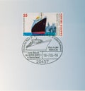 GERMANY - CIRCA 2004: the postal stamp shows an ocean ship in front of the New York skyline and the text 1929 winning the blue rib