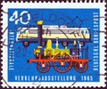 GERMANY - CIRCA 1965: A stamp printed in Germany shows Locomotive Adler 1835 and Class E.10.12 electric locomotive 1960s Royalty Free Stock Photo