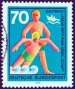 GERMANY - CIRCA 1970: A stamp printed in Germany shows rescue from drowning, circa 1970. Royalty Free Stock Photo