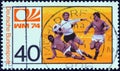 GERMANY - CIRCA 1974: A stamp printed in Germany from the `World Cup Football Championship` issue shows midfield melee