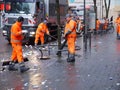 Employees of the urban street cleaning clean the street from the garbage