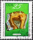 GERMANY, DDR - CIRCA 1978 : a postage stamp from Germany, GDR showing an agate found in Wiederau, Rochlitz district. Text: