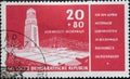 GERMANY, DDR - CIRCA 1956 : a postage stamp from Germany, GDR showing the bell tower of the concentration camp memorial of the Buc