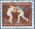 GERMANY, DDR - CIRCA 1960 : a postage stamp from Germany, GDR showing a boxing match with boxing gloves Text: 1960 Summer Olympic