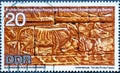 GERMANY, DDR - CIRCA 1970: a postage stamp from Germany, GDR showing a cattle frieze detail Text: Archaeological Research of the Royalty Free Stock Photo