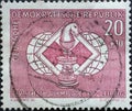 GERMANY, DDR - CIRCA 1960 : a postage stamp from Germany, GDR showing a chess piece knight in front of a stylized chessboard and t