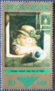 GERMANY, DDR - CIRCA 1973 : a postage stamp from Germany, GDR showing a child with a doll; by Christian Leberecht Vogel. Dresden