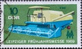 GERMANY, DDR - CIRCA 1969: a postage stamp from Germany, GDR showing a combine harvester E 512 for the Leipzig spring fair 1969