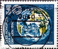 GERMANY, DDR - CIRCA 1990: a postage stamp from Germany, GDR showing the earth with geographic coordinates latitude and longitude
