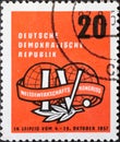 GERMANY, DDR - CIRCA 1957 : a postage stamp from Germany, GDR showing the emblem of the 4th World Trade Union Congress in Leipzig.