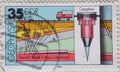 GERMANY, DDR - CIRCA 1980 : a postage stamp from Germany, GDR showing equipment and graphical representations for geophysics: seis