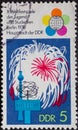 GERMANY, DDR - CIRCA 1973 : a postage stamp from Germany, GDR showing a fireworks over Berlin and a globe sign. Text: World Festiv