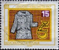 GERMANY, DDR - CIRCA 1967: a postage stamp from Germany, GDR showing a fur coat for the Leipzig Autumn Fair 1967