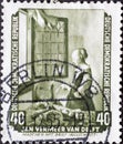 GERMANY, DDR - CIRCA 1955 : a postage stamp from Germany, GDR showing Girl reading a letter at the window by Jan Vermeer van Delf