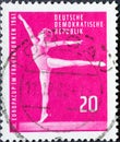 GERMANY, DDR - CIRCA 1961 : a postage stamp from Germany, GDR showing a gymnast with an exercise on the balance beam. European Cup Royalty Free Stock Photo