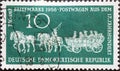 GERMANY, DDR - CIRCA 1958 : a postage stamp from Germany, GDR showing a historic four-horse mail wagon of the Saxon Passenger Post