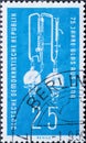 GERMANY, DDR - CIRCA 1959 : a postage stamp from Germany, GDR showing a laboratory bi-distillation apparatus made of fireproof Jen