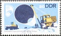 GERMANY, DDR - CIRCA 1978 : a postage stamp from Germany, GDR showing laying a piece of pipe a pipeline, badge of honor `builder