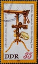 GERMANY, DDR - CIRCA 1980 : a postage stamp from Germany, GDR showing a microscope by Giovanni Battista Amici; Modena 1845. in t